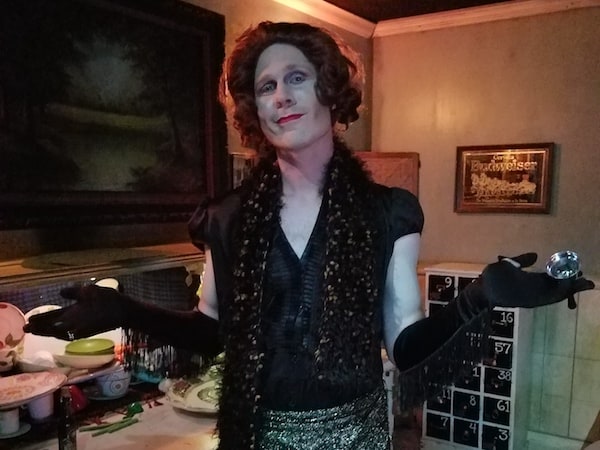 Miss Jezebel poses in glitzy tea party attire.