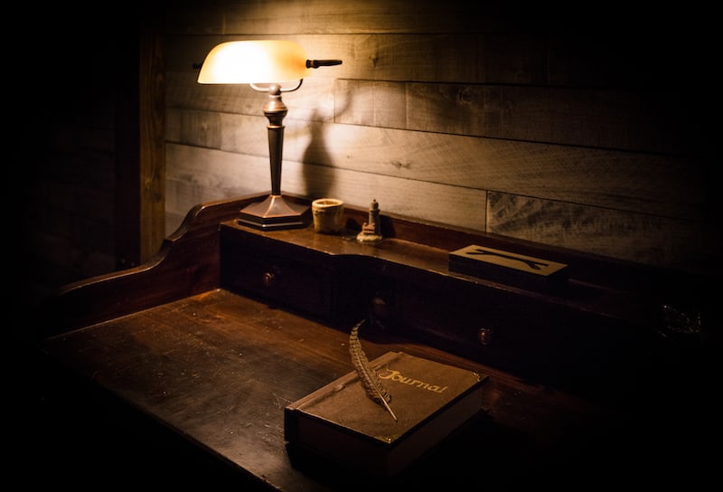 In-game: A beautiful old writer's desk with a journal and a quill pen.