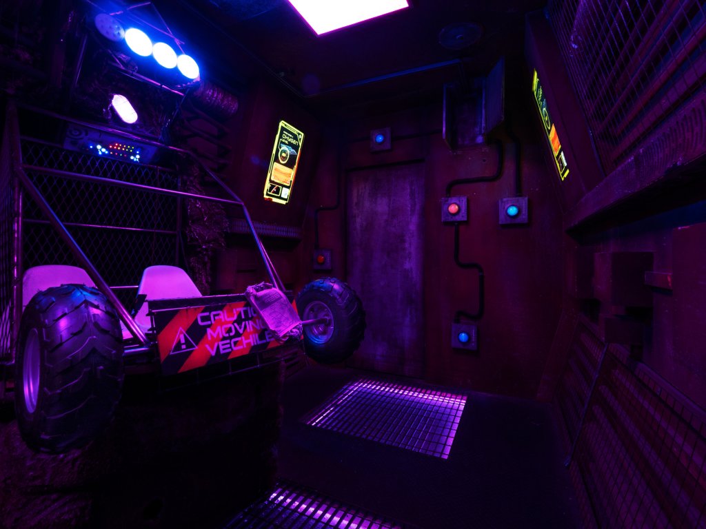 dim room, with what looks like the back end of an off road vehicle.