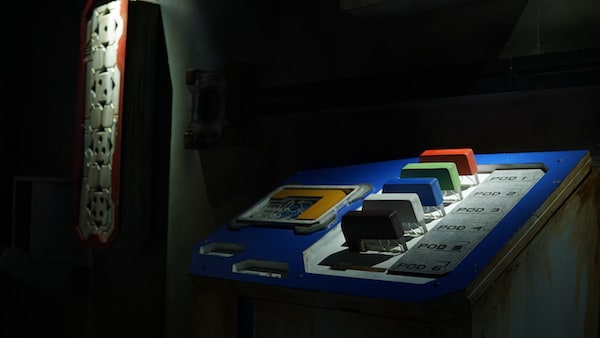 In-game: An input terminal with different disks input into slots.