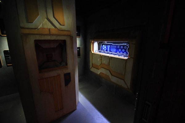 In-game: A futuristic blue, glowing screen and interface.