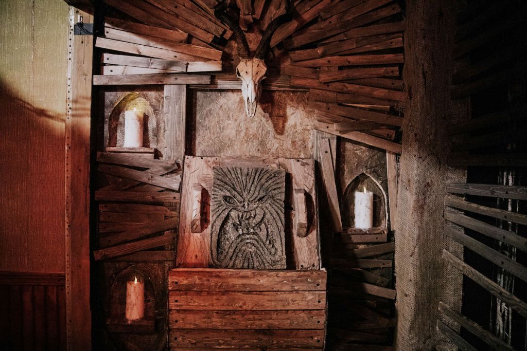 A necronomicon sitting on a demonic alter.