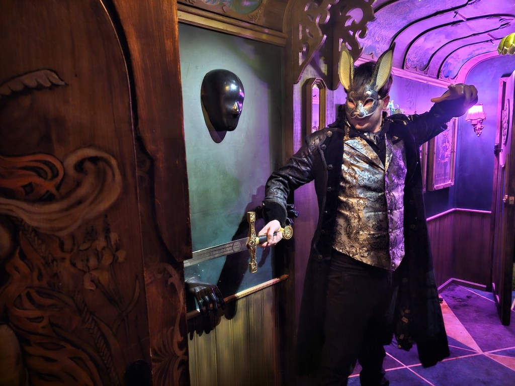 Magician rabbit sliding a sword into a box.