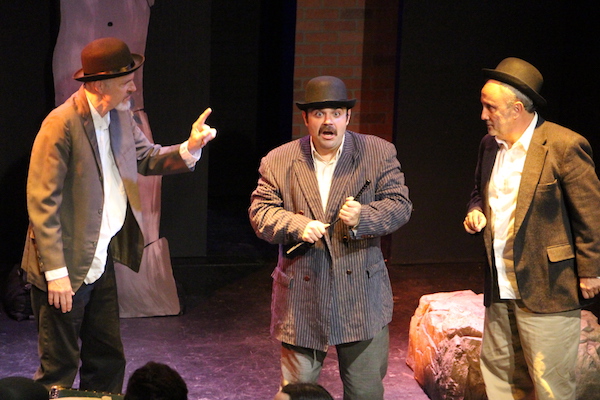 In-game: Three actors performing a scene. One actor looks very surprised. 