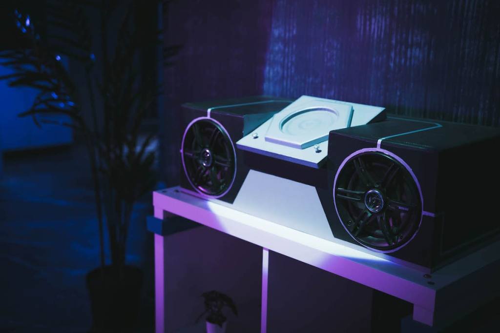 A futuristic boombox in a cyberpunk apartment.