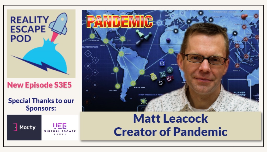 caucasian man wearing glasses with short hair in a white patterned button down shirt in front of the Pandemic game board.
