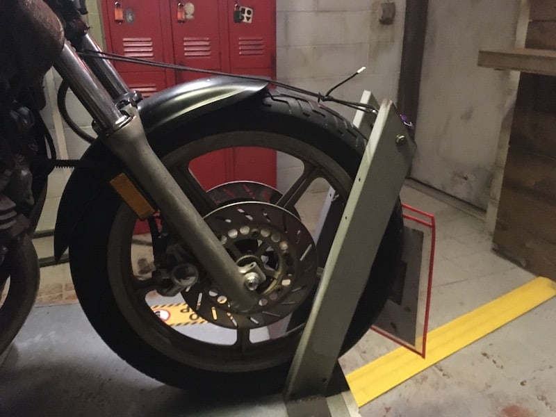 In-game: closeup of a motorcycle wheel.