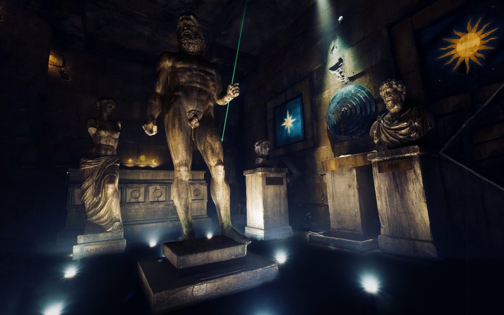 room with many antique looking roman statues and pedestals