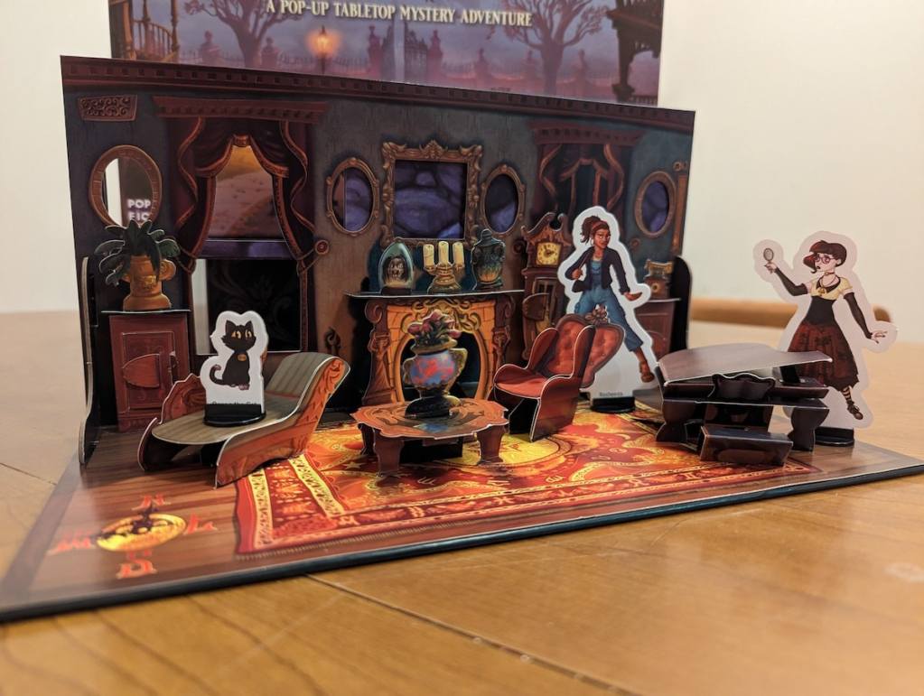 Pop up of a victorian parlor with pop up furniture and characters investigating.