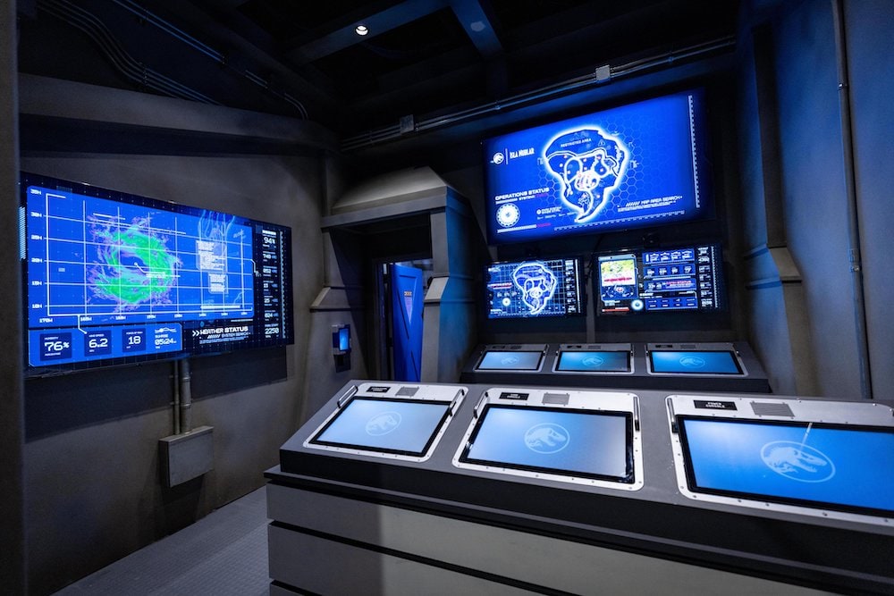 A bank of computers in the control center for Jurassic World.