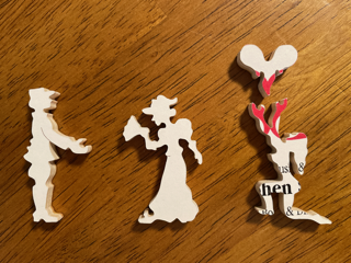 wooden jigsaw pieces cut into silouettes of people