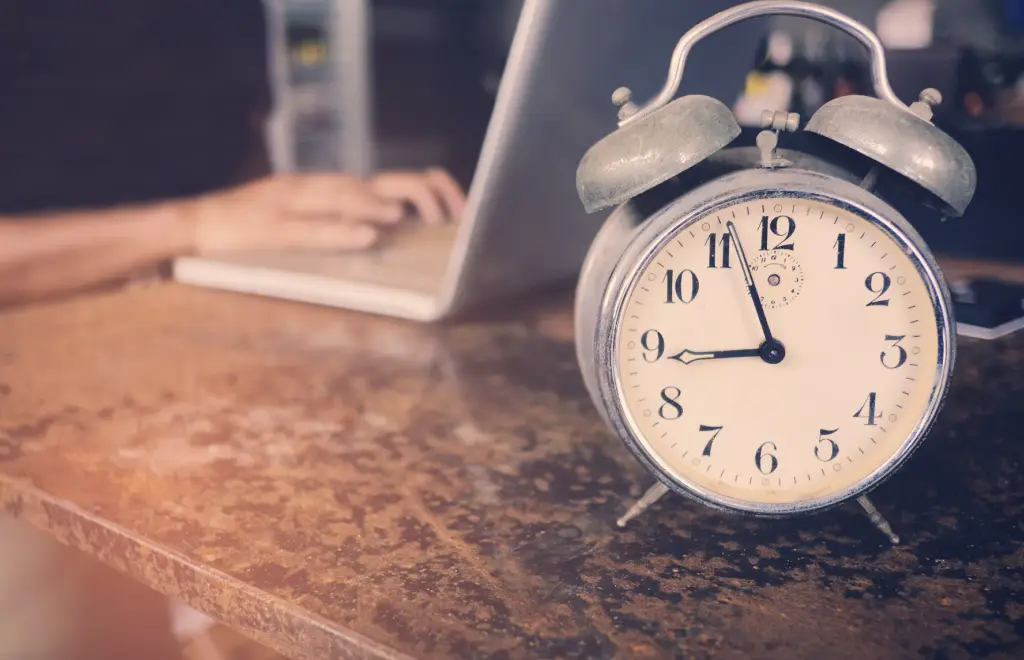 a clock on a table to manage time