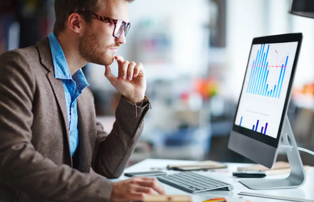 a man monitoring a project management risk in a pc